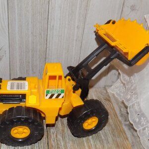 TOY TRACTOR YELLOW PLASTIC *